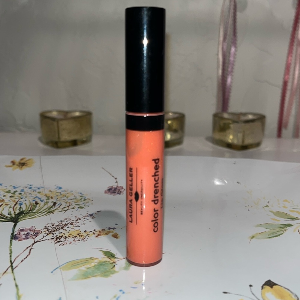 Laura Geller Color Drenched Lip Gloss in Melon Infusion firm